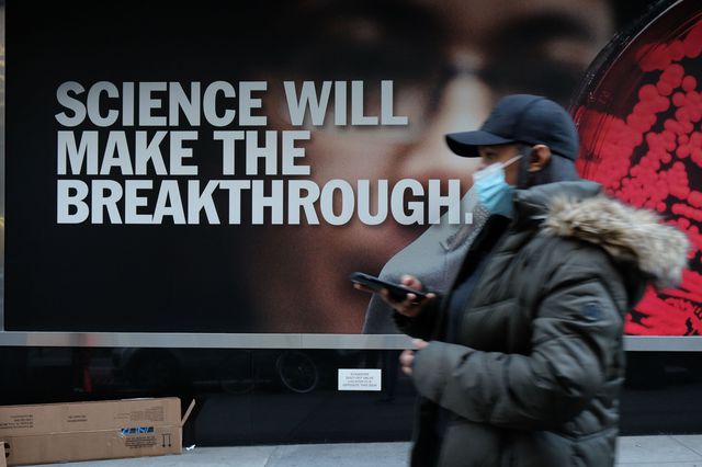 People walk by the Pfizer headquarters in New York City November 20th.